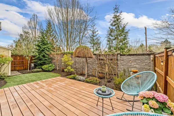 a view of a patio with table and chairs and potted plants