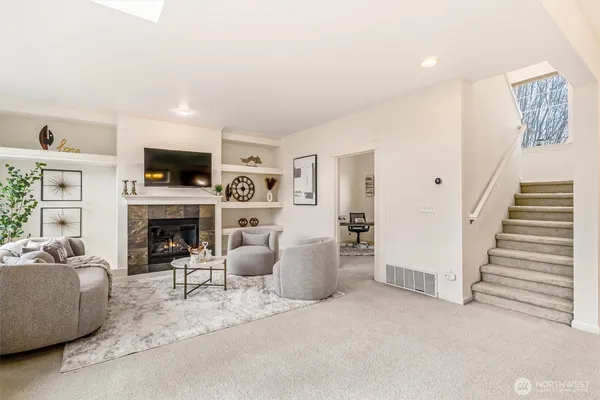 a living room with furniture or flat screen tv and a fireplace