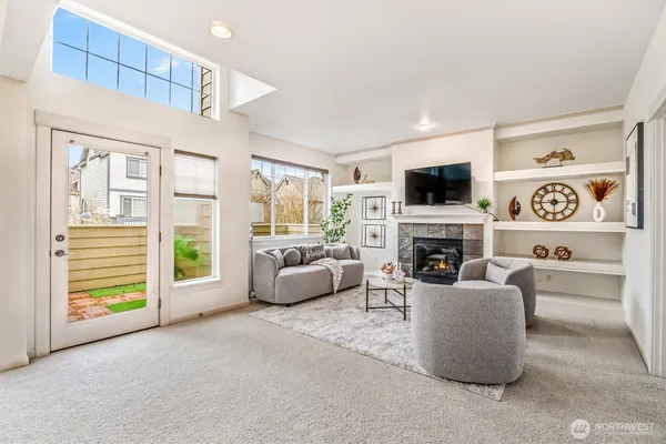 a living room with furniture fireplace and a flat screen tv