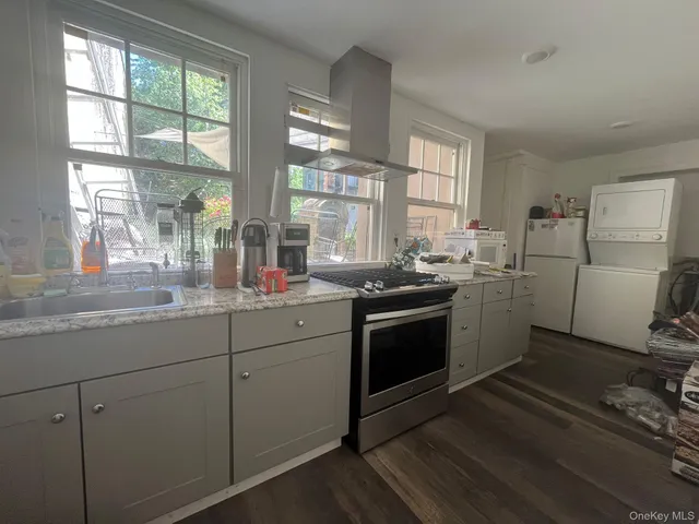 a kitchen with sink cabinets and window