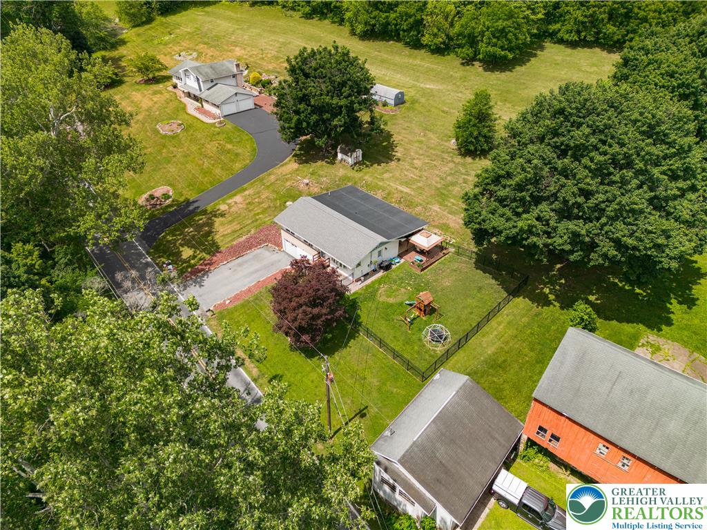 50 Kohls Road Northampton, PA 18067 - Photo 47 of 54 An aerial perspective reveals the expansive grounds of a secluded property, featuring a long driveway and mature trees.