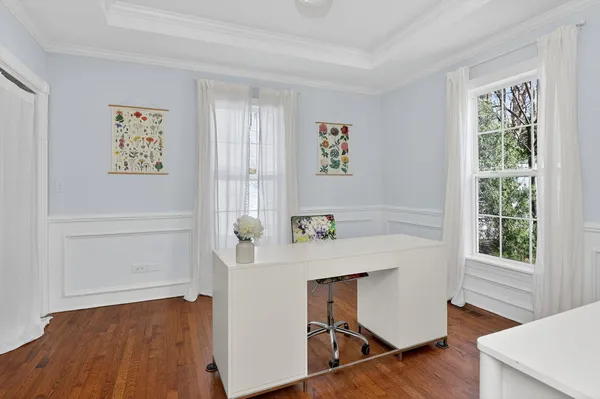 a workspace with furniture and wooden floor