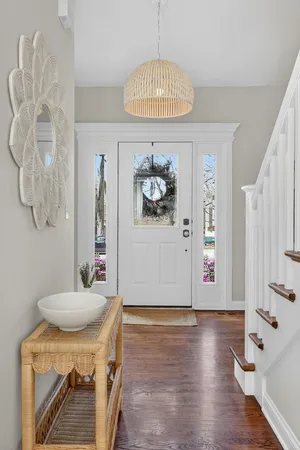 a view of room with furniture and chandelier