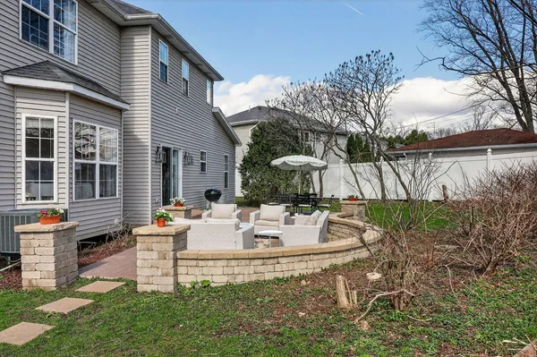 a view of a couches and lounge chairs in the patio