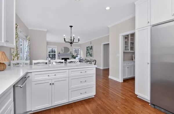 a spacious bathroom with a double vanity sink a mirror and a shower