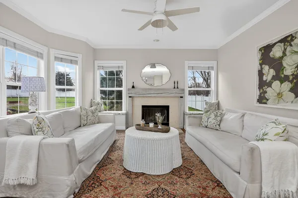 a living room with furniture and a fireplace
