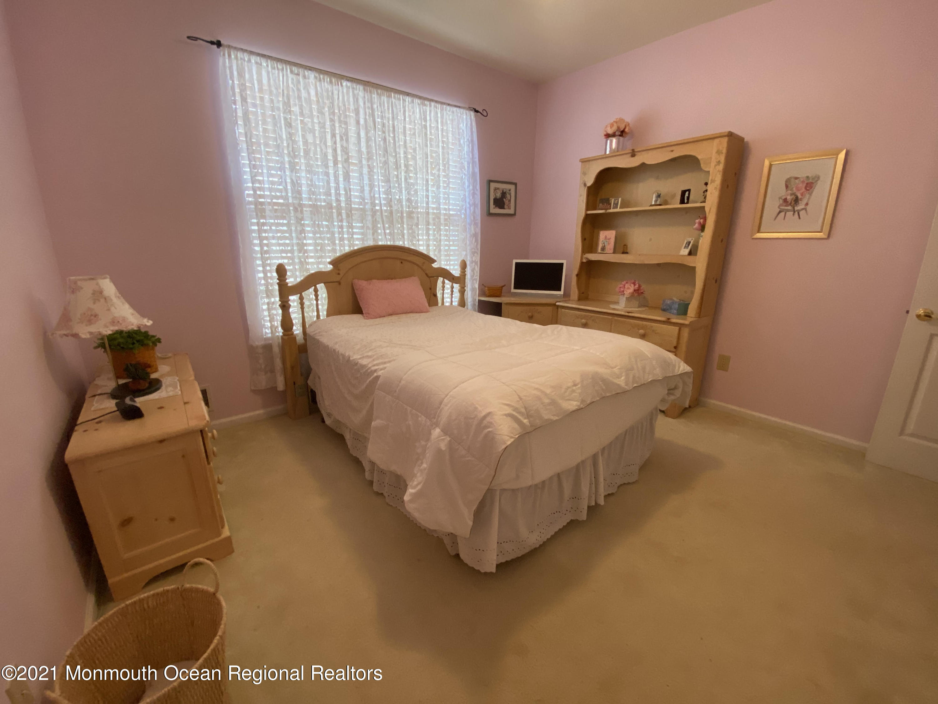 47 Sandpiper Road Barnegat, NJ 08005 - Photo 13 of 15 a bed sitting in a bedroom next to a window