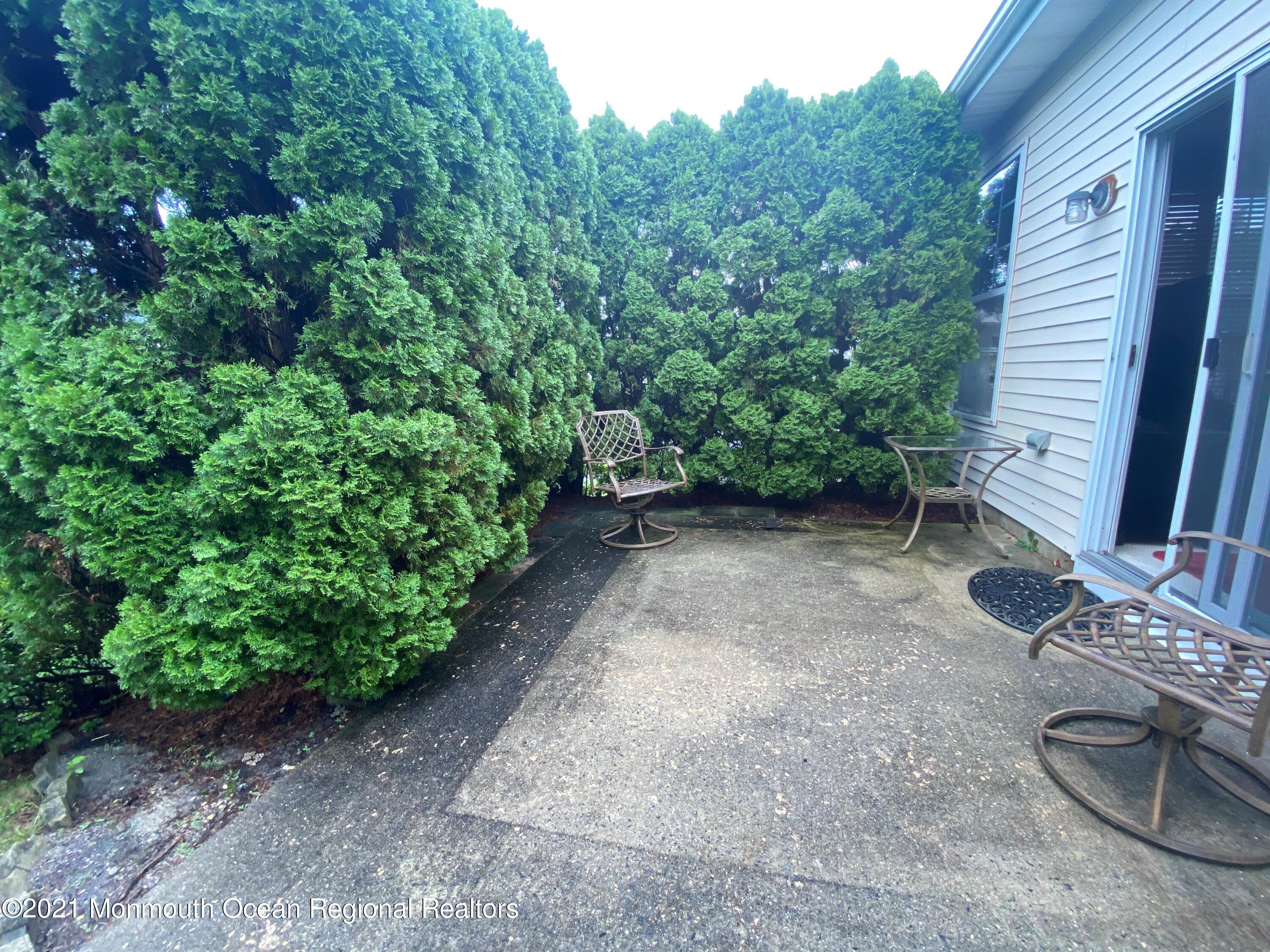 47 Sandpiper Road Barnegat, NJ 08005 - Photo 15 of 15 a view of a backyard with chairs