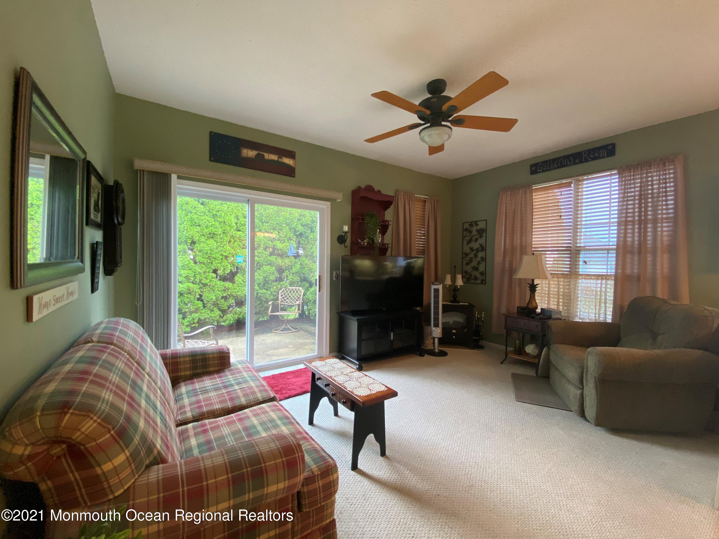47 Sandpiper Road Barnegat, NJ 08005 - Photo 9 of 15 a living room with furniture and a large window
