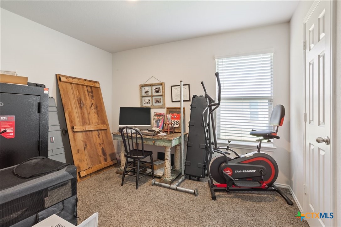 1000 Velvet Court Troy, TX 76579 - Photo 19 of 25 a view of a workspace with furniture and a window