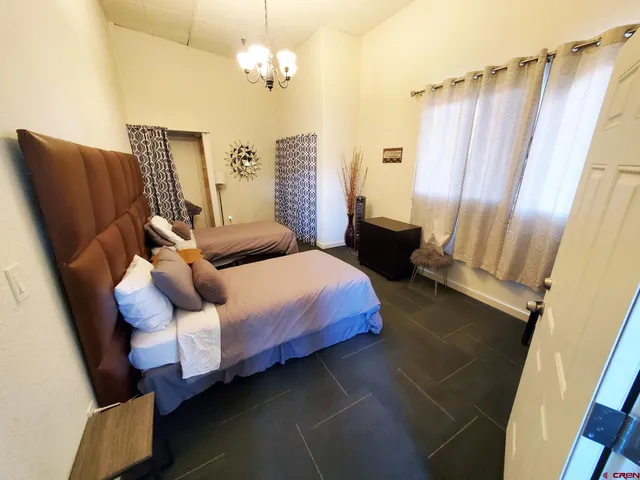 a bedroom with a bed furniture and a window