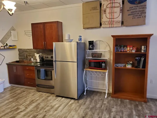 a kitchen with appliances and cabinets
