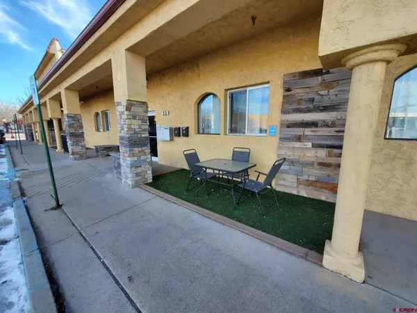 a view of backyard with barbeque grill and stairs