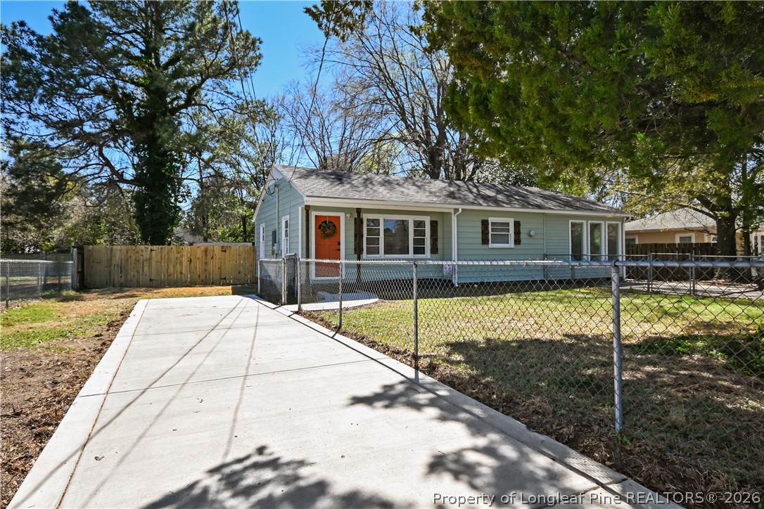 5307 Cypress Road Fayetteville, NC 28304 - Photo 2 of 36 a view of a house with backyard and tree