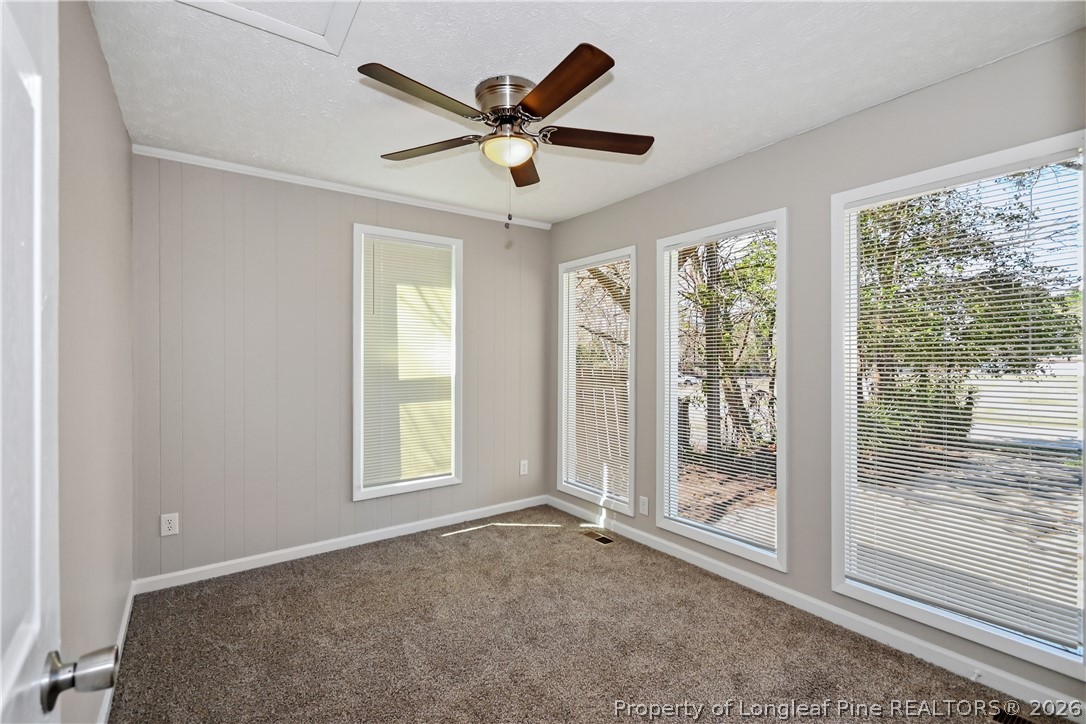 5307 Cypress Road Fayetteville, NC 28304 - Photo 21 of 36 a view of a livingroom with a ceiling fan and window