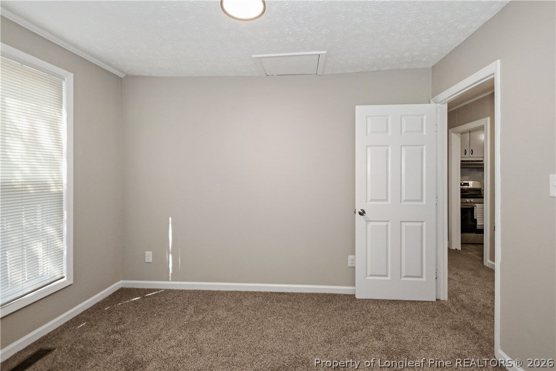 5307 Cypress Road Fayetteville, NC 28304 - Photo 23 of 36 an empty room with windows