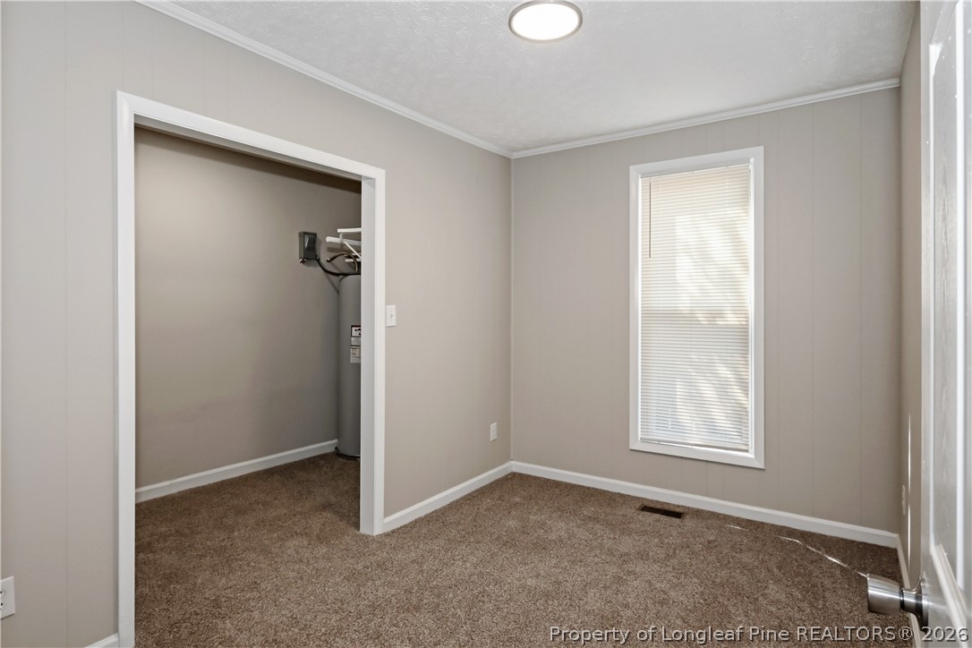 5307 Cypress Road Fayetteville, NC 28304 - Photo 24 of 36 an empty room with windows and closet