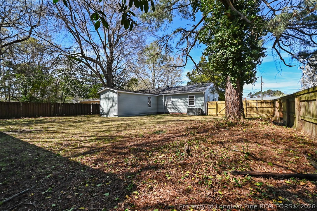 5307 Cypress Road Fayetteville, NC 28304 - Photo 31 of 36 a house with trees in front of it
