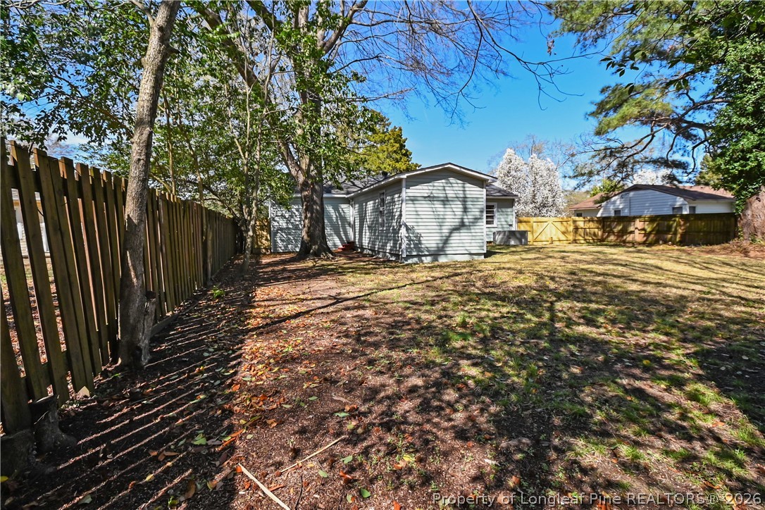 5307 Cypress Road Fayetteville, NC 28304 - Photo 32 of 36 a view of a yard with wooden fence