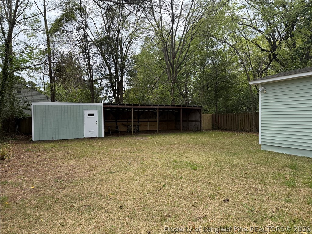 5307 Cypress Road Fayetteville, NC 28304 - Photo 34 of 36 front view of a house with a large window and a large tree