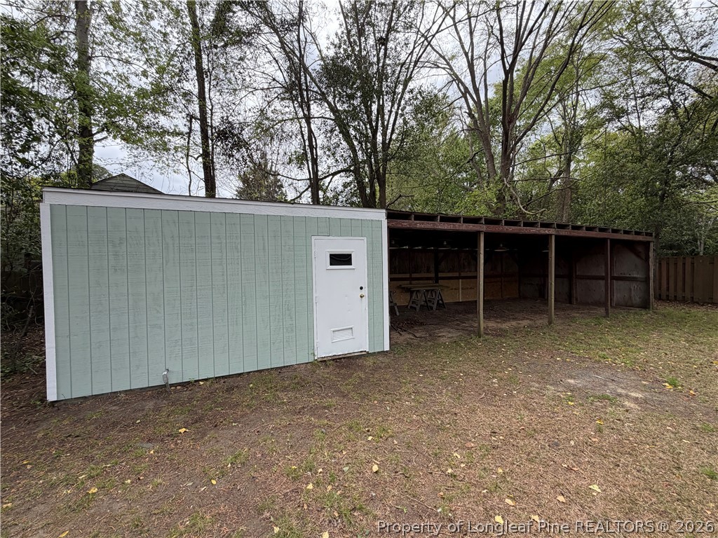 5307 Cypress Road Fayetteville, NC 28304 - Photo 35 of 36 a view of a house with a backyard