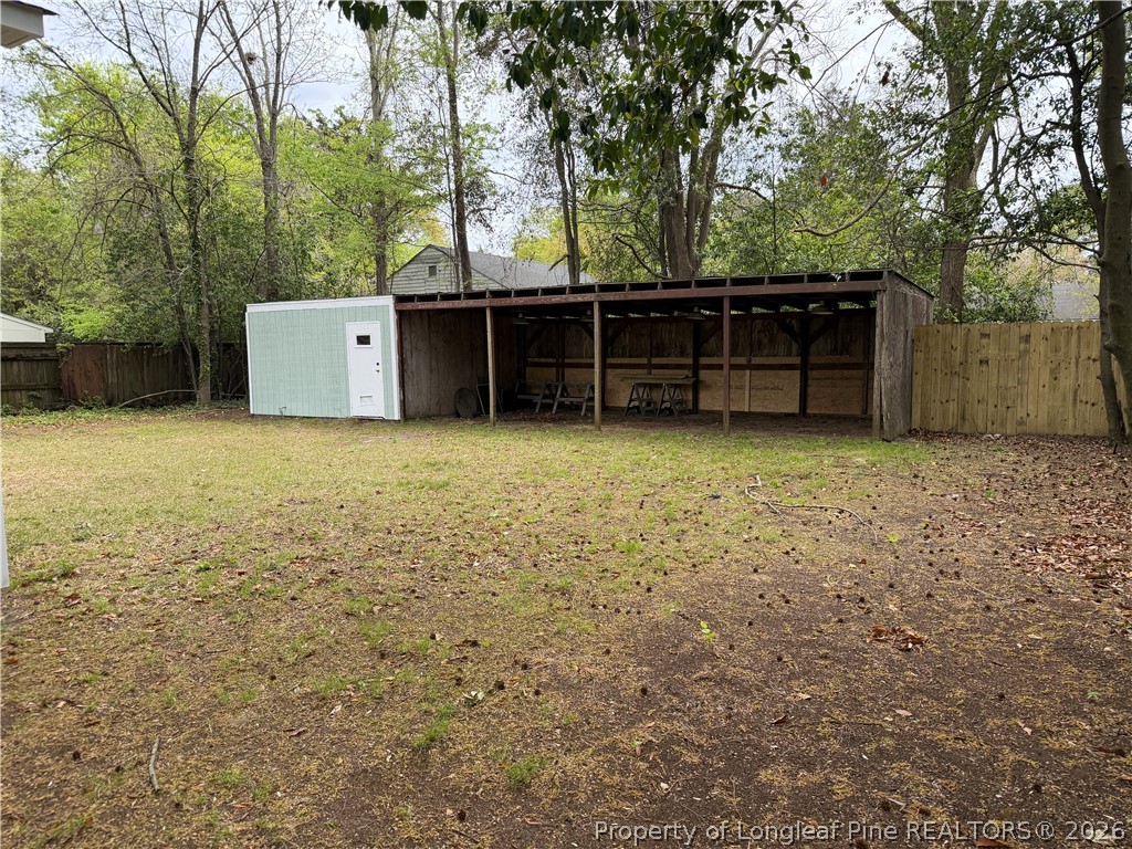 5307 Cypress Road Fayetteville, NC 28304 - Photo 36 of 36 a view of a house with backyard and trees