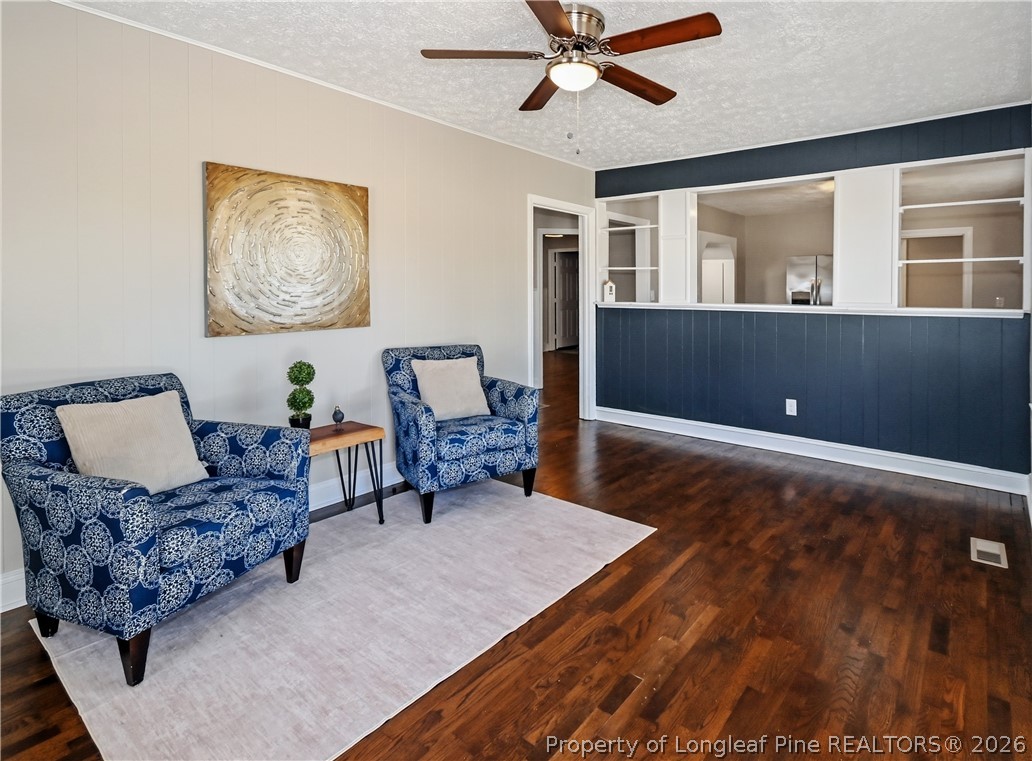 5307 Cypress Road Fayetteville, NC 28304 - Photo 4 of 36 a living room with furniture and a wooden floor