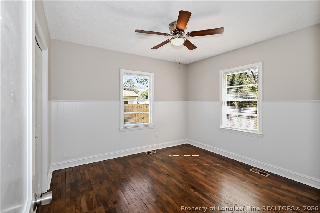 5307 Cypress Road Fayetteville, NC 28304 - Photo 7 of 36 a view of a big room with wooden floor and windows