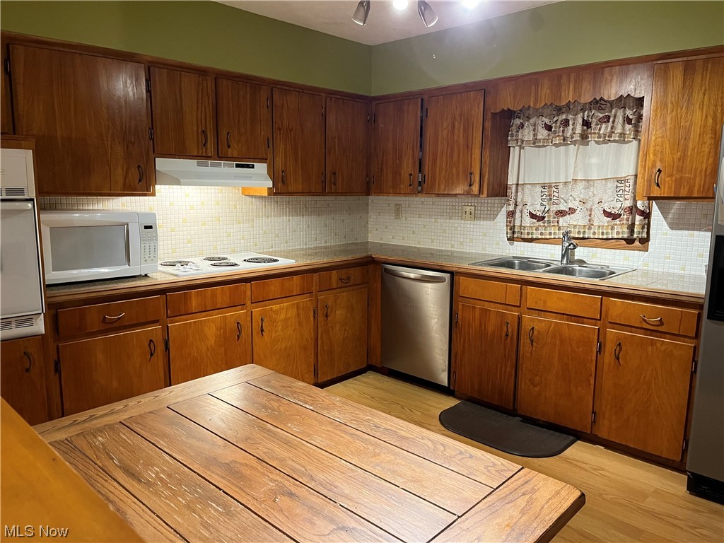 Kitchen with brown cabinets
