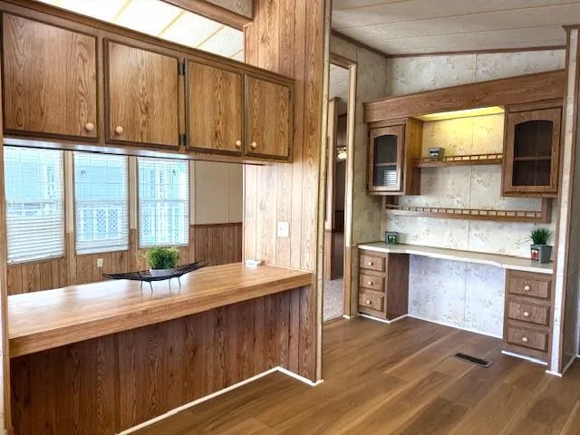 a kitchen with stainless steel appliances granite countertop a sink and a microwave