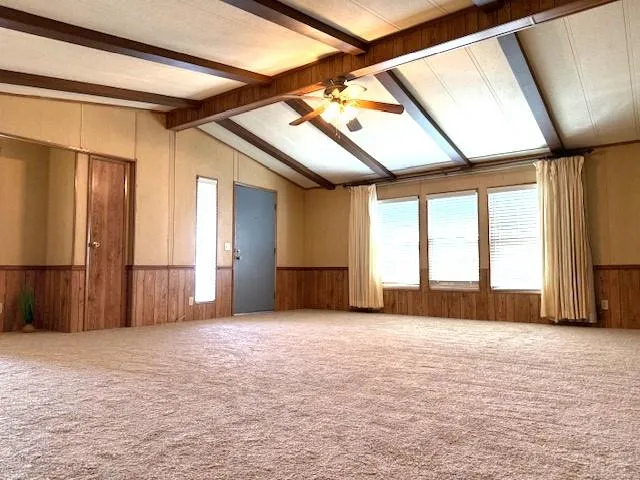 a view of empty room with a fireplace