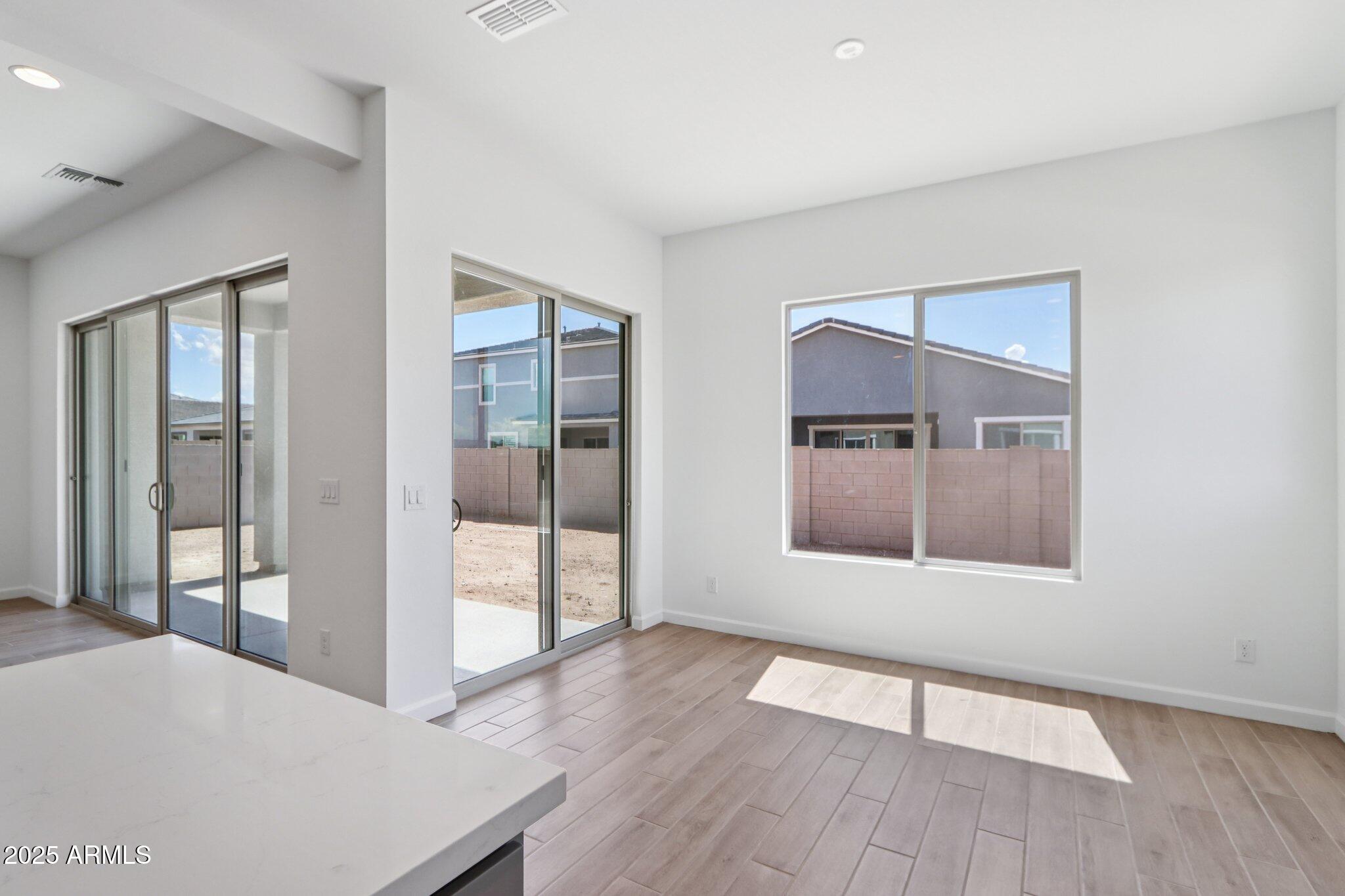 11417 East Utah Avenue Mesa, AZ 85212 - Photo 17 of 55 wooden floor in an empty room with a window