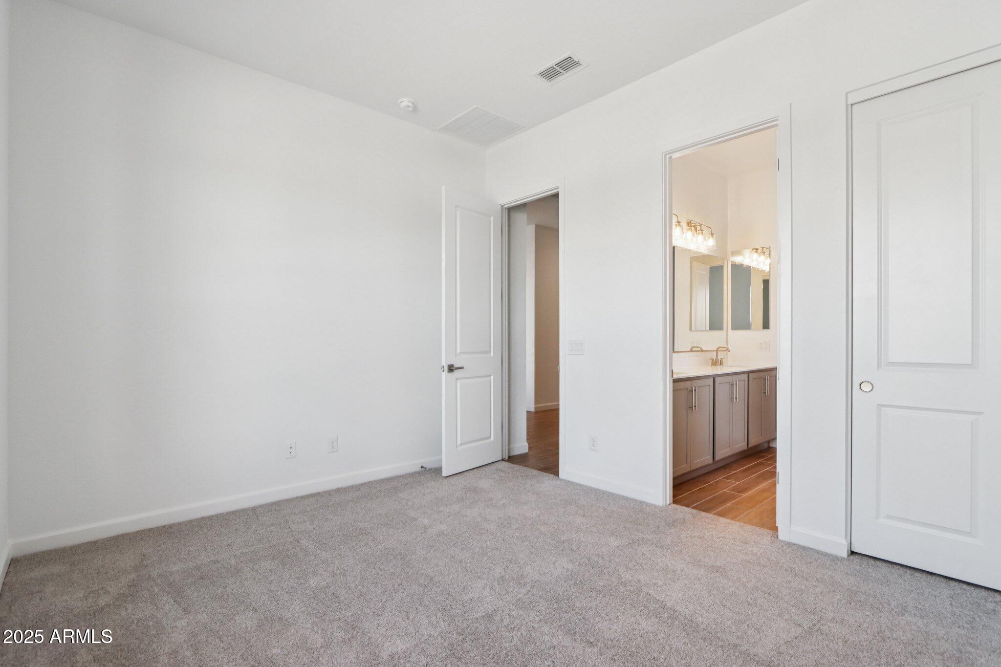 11417 East Utah Avenue Mesa, AZ 85212 - Photo 20 of 55 an empty room with windows