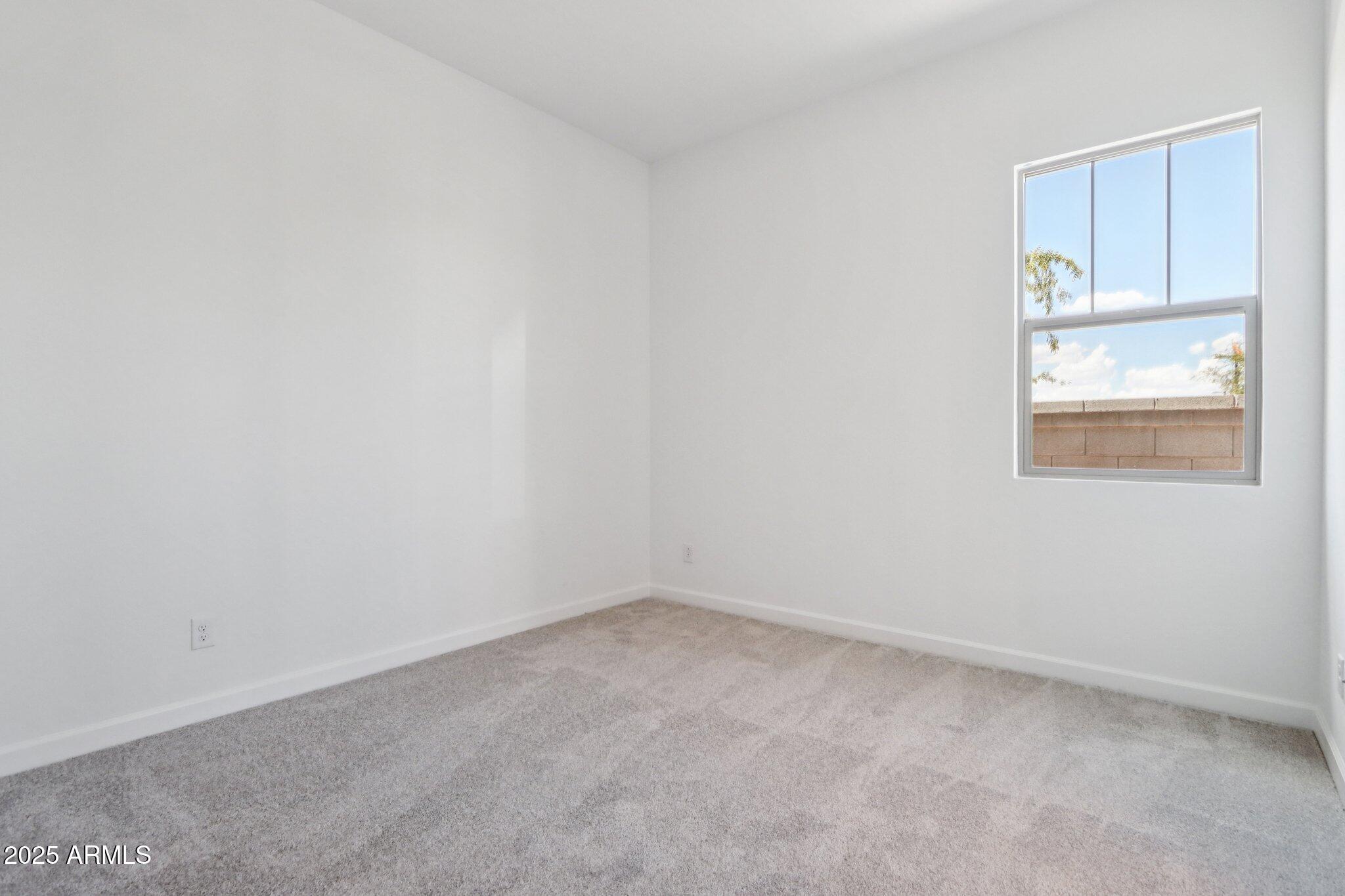 11417 East Utah Avenue Mesa, AZ 85212 - Photo 25 of 55 an empty room with a window