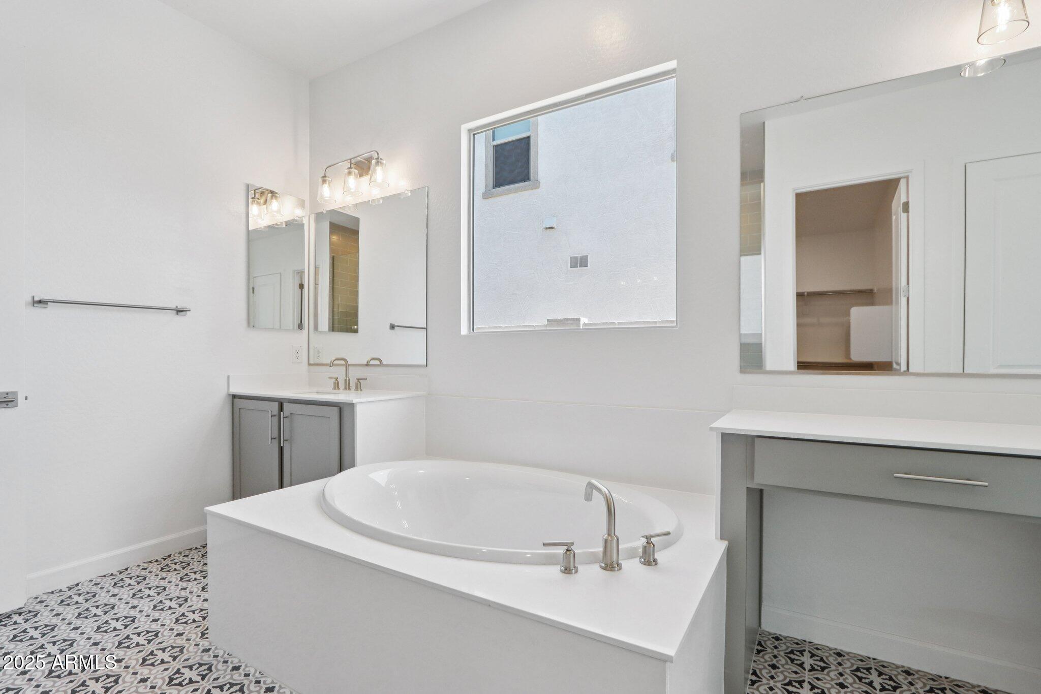 11417 East Utah Avenue Mesa, AZ 85212 - Photo 29 of 55 a bathroom with a sink and a mirror