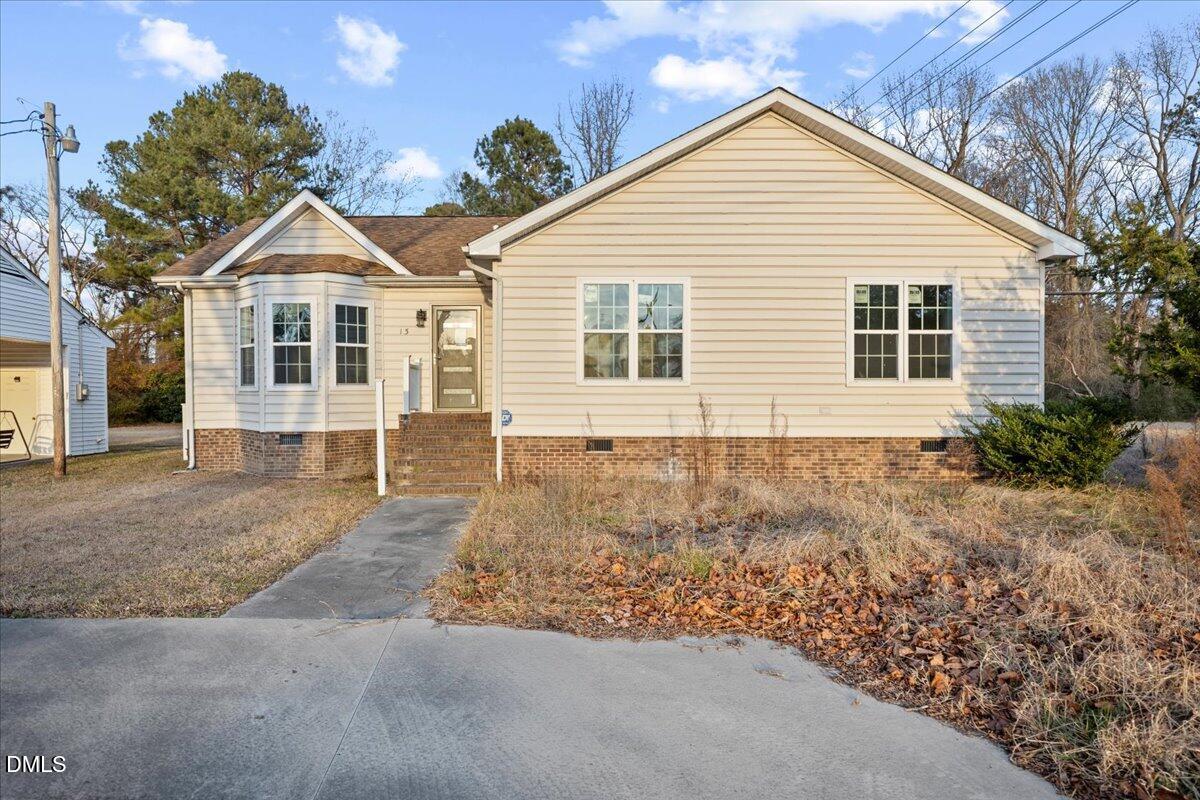 a view of a house with a yard and garage