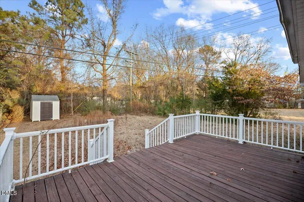 a view of deck with wooden floor and fence