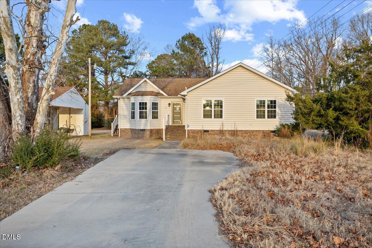 413 South Main Street Princeville, NC 27886 - Photo 4 of 21 front view of a house with a yard