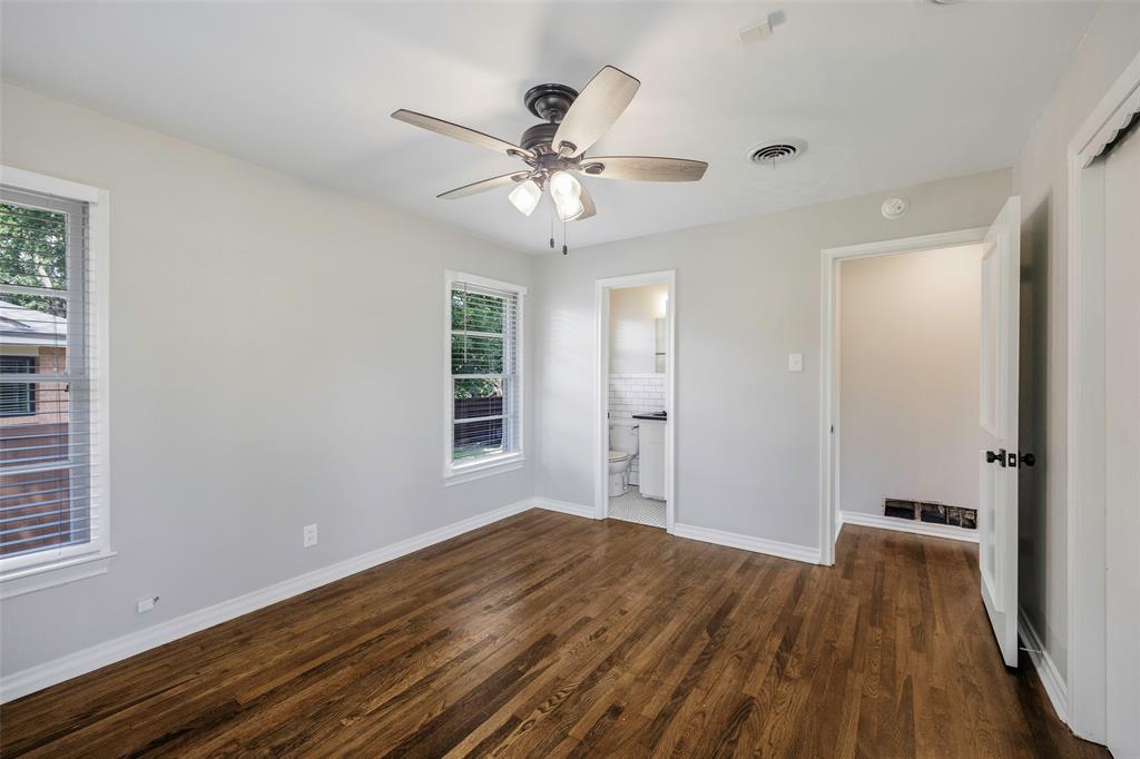 2323 Sutter Street Dallas, TX 75216 - Photo 18 of 30 Master bedroom with ceiling fan, a healthy amount of sunlight, and dark wood-type flooring