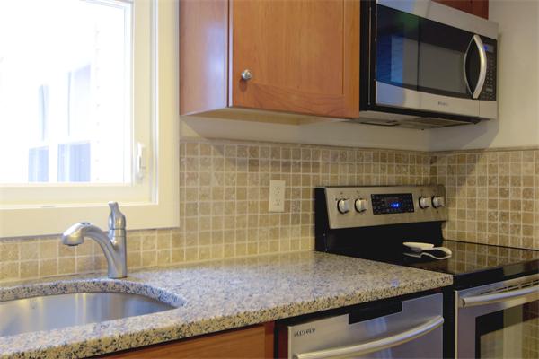 253 Liberty Square Road Boxborough, MA 01719 - Photo 7 of 21 a kitchen with granite countertop a sink and a stove