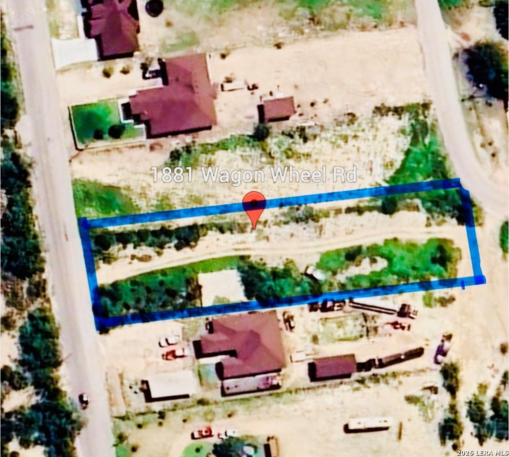 1881 Wagon Wheel Road Eagle Pass, TX 78852 - Photo 1 of 4 an aerial view of a houses
