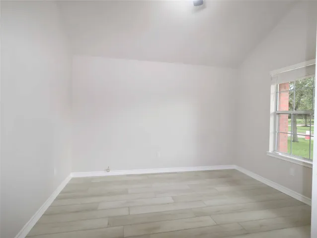 a view of an empty room and window
