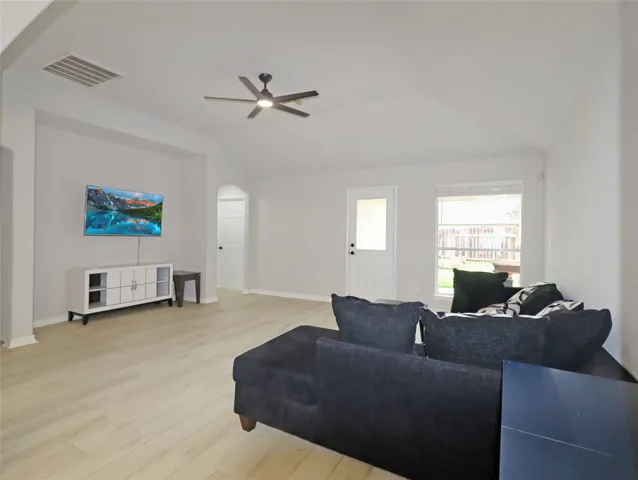 a living room with furniture and a window