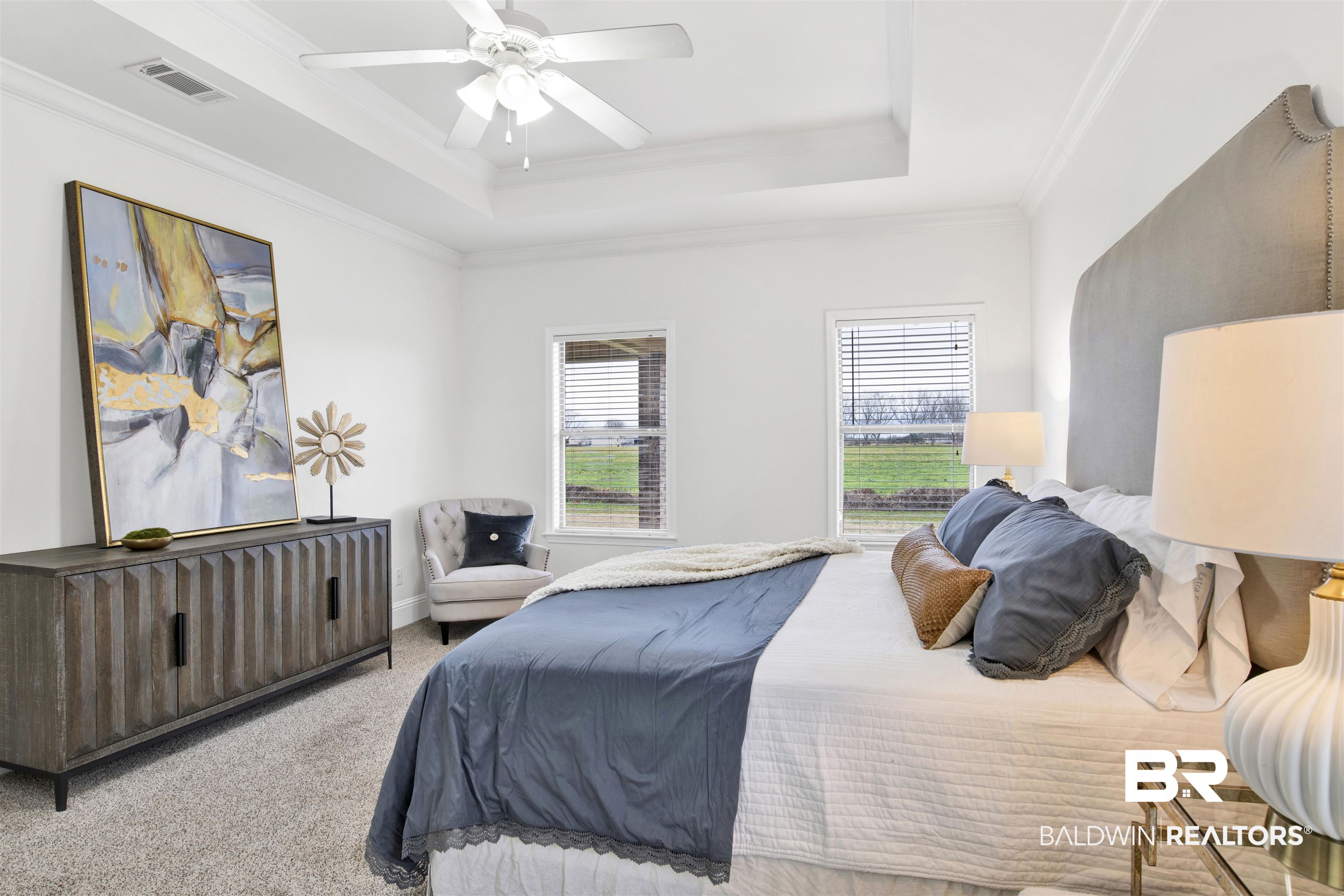 25350 Spindle Lane Daphne, AL 36526 - Photo 18 of 32 Bedroom featuring a tray ceiling, ornamental molding, light colored carpet, and ceiling fan