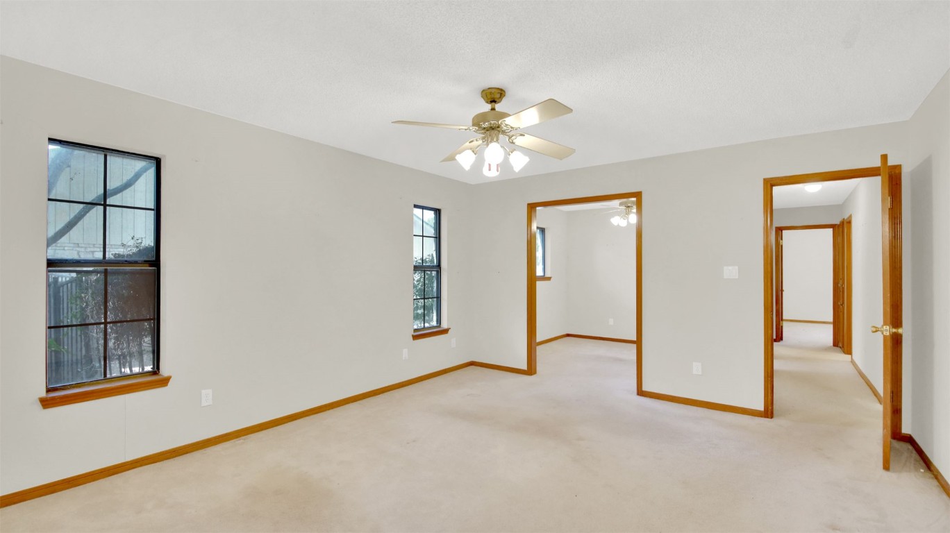 1403 Stone Ridge Drive Taylor, TX 76574 - Photo 28 of 39 Unfurnished bedroom featuring carpet and a ceiling fan