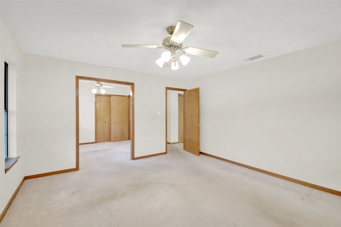 1403 Stone Ridge Drive Taylor, TX 76574 - Photo 29 of 39 Unfurnished bedroom with a ceiling fan and carpet