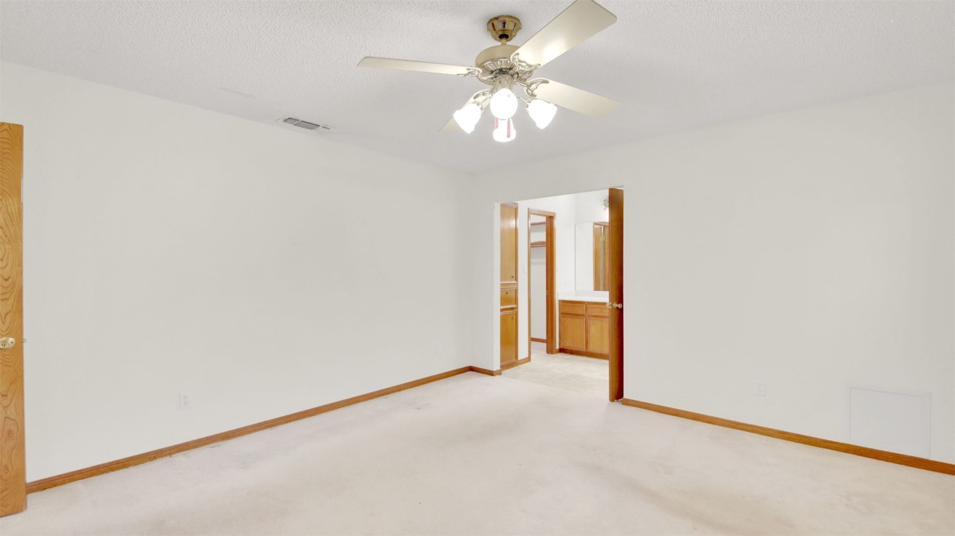 1403 Stone Ridge Drive Taylor, TX 76574 - Photo 30 of 39 Carpeted empty room with baseboards and a ceiling fan