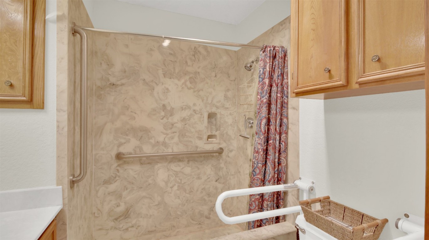 1403 Stone Ridge Drive Taylor, TX 76574 - Photo 32 of 39 Full bathroom featuring vanity and a shower with curtain