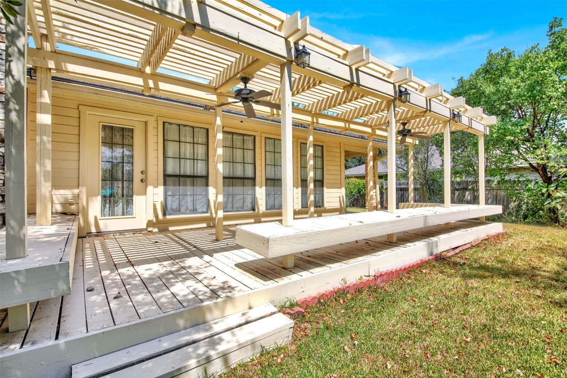 1403 Stone Ridge Drive Taylor, TX 76574 - Photo 35 of 39 Wooden terrace with ceiling fan