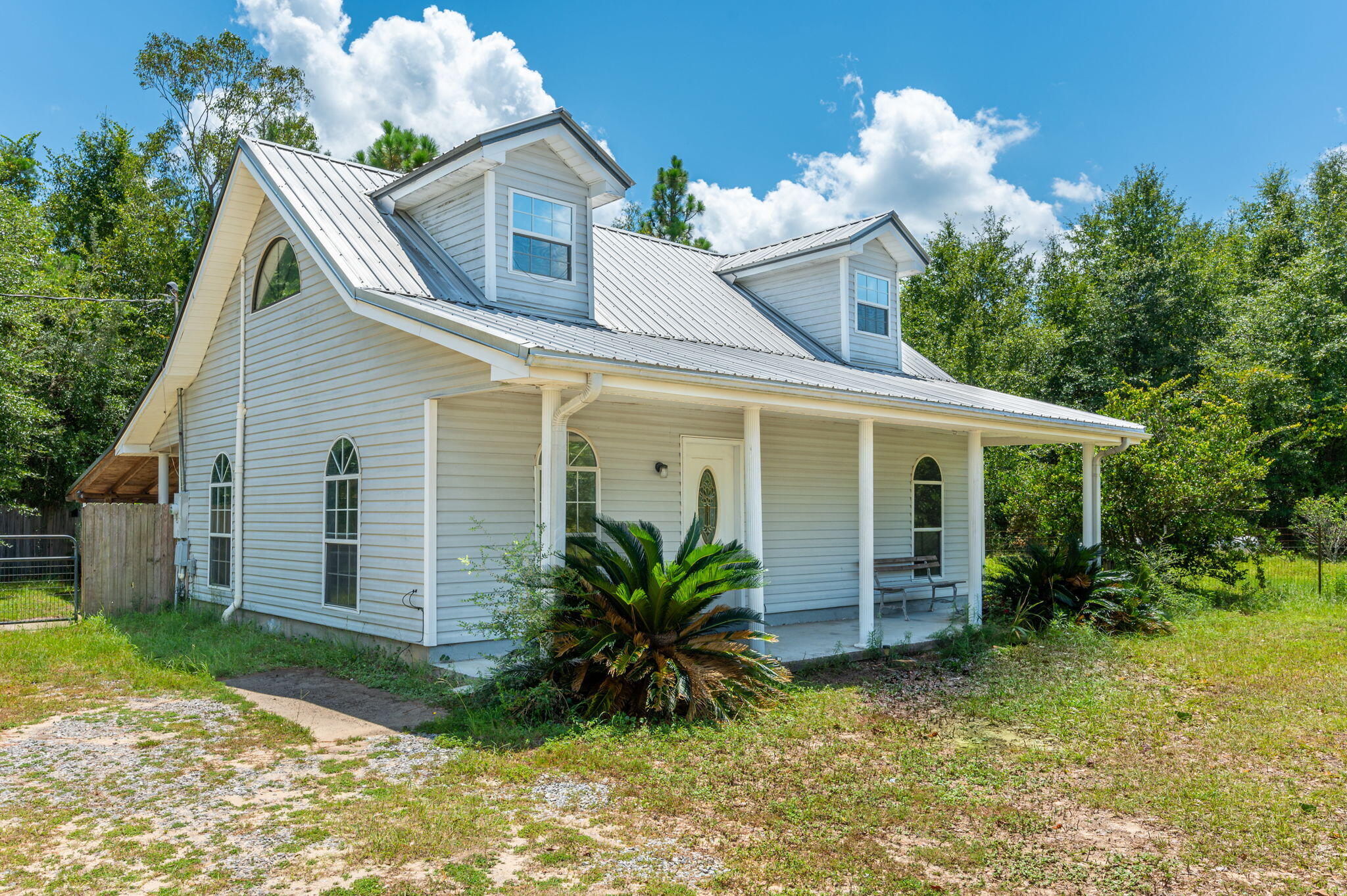 1361 Long Road DeFuniak Springs, FL 32433 - Photo 1 of 43 a view of house with a yard and sitting area